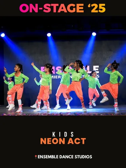 The Kids Neon Act from 'ON-STAGE '25'. The vibrant costumes pop under the stage lights as the children perform a dynamic hip-hop inspired routine they learned in our classes.