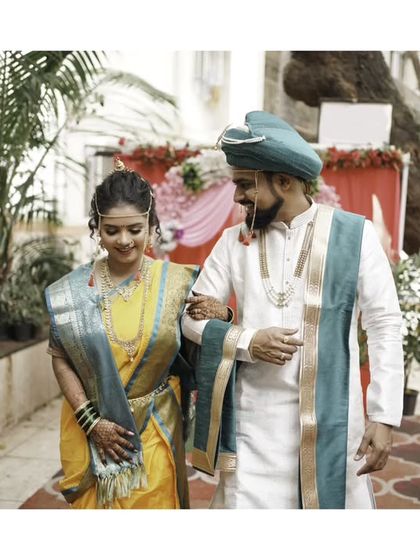 A candid walking shot, capturing the couple's natural interaction and happiness.