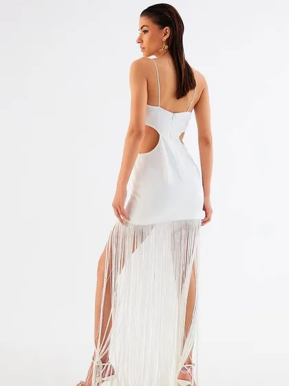The back view of the white fringe dress by Tisharth by Shivani, highlighting the cutout details.