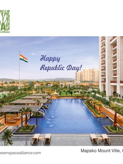The landscape for Mapsko Mount Ville in Gurgaon features an expansive swimming pool and manicured gardens. This image, with the Indian flag flying proudly, showcases a premium residential amenity that offers residents a resort-like experience and a space for community celebration.