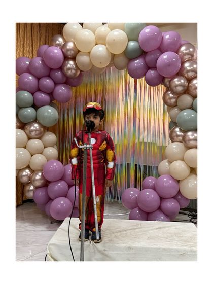 Iron Man strikes a pose, showing off his costume and his confidence.