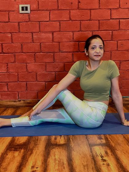 A gentle seated spinal twist, or Ardha Matsyendrasana, can help improve digestion and increase spinal flexibility. During pregnancy, we modify this pose to ensure it is safe and comfortable, creating space for the belly while still getting the benefits of the twist.