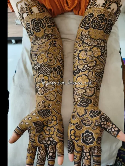 A beautiful example of a dense, full-arm bridal design where every inch is covered in art. The contrast between the dark and light shading gives it a wonderful texture.