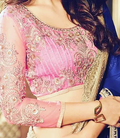 A pink blouse with full-length sheer sleeves and heavy embroidery. This classic design offers an elegant look while providing more coverage.