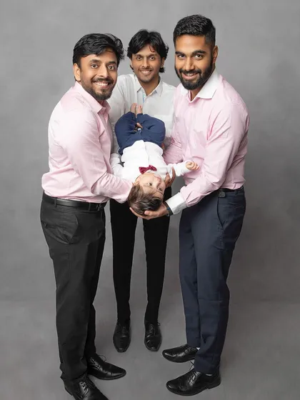 A playful moment with the uncles! This fun, candid shot shows the joyful and energetic side of family photos, proving that not every picture has to be a formal pose.