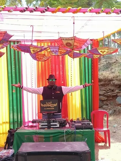 Entertainment is key to a successful event. We arrange for professional DJs and MCs, providing a complete sound and stage setup that matches the event's theme, as seen here at this outdoor corporate party.