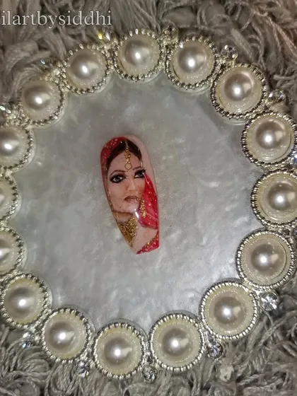 The full view of the hand-painted bride portrait nail, displayed beautifully.