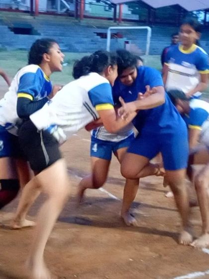 Another angle of an intense tackle, showcasing the strength and determination of our female Kabaddi players.