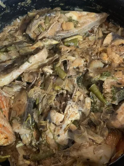A pot of fish cooked with banana flower and bamboo shoot.