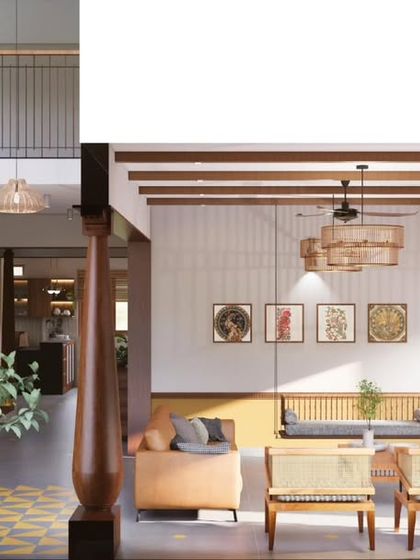 A split view showing the double-height courtyard and the living area of the South Bangalore duplex. This illustrates how I use vertical space and traditional elements like columns to create drama and flow.