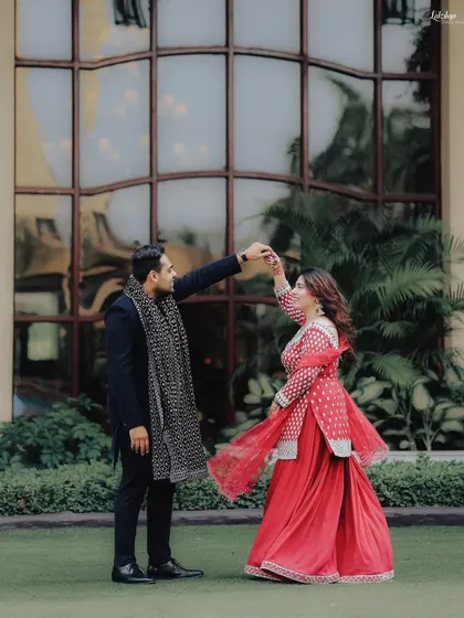 A candid moment of the couple sharing a dance in the garden during their Roka ceremony. It’s these spontaneous moments of joy that make the best memories.