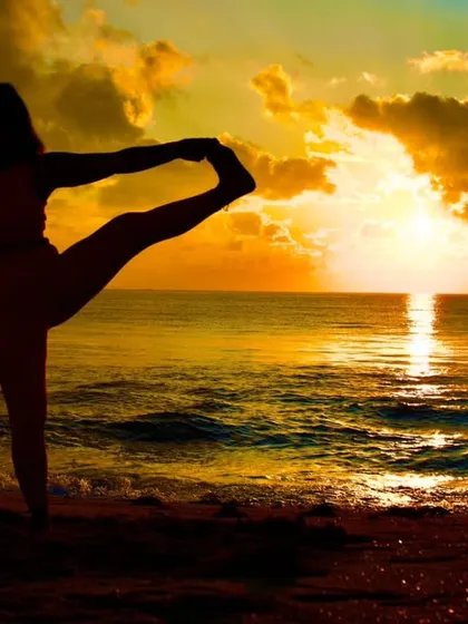 There is a special kind of peace that comes from practicing in nature. Holding Utthita Hasta Padangusthasana, or Extended Hand-To-Big-Toe Pose, against a sunrise reminds me of the balance we seek both on and off the mat.