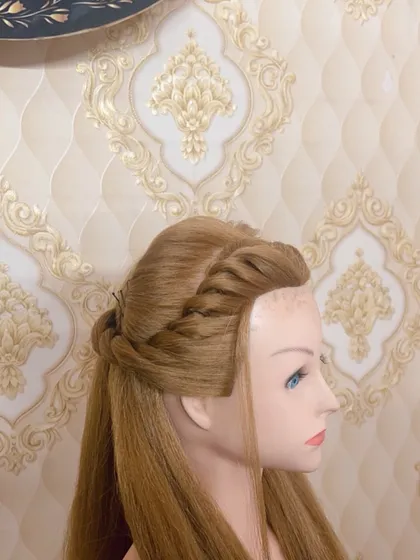 A still image of the finished half-up twist hairstyle. This is a great style for clients who want to keep their hair open but with a special touch.