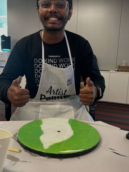 Thumbs up from another happy participant at the NetApp resin clock workshop. These events are all about positive experiences and building stronger team connections.