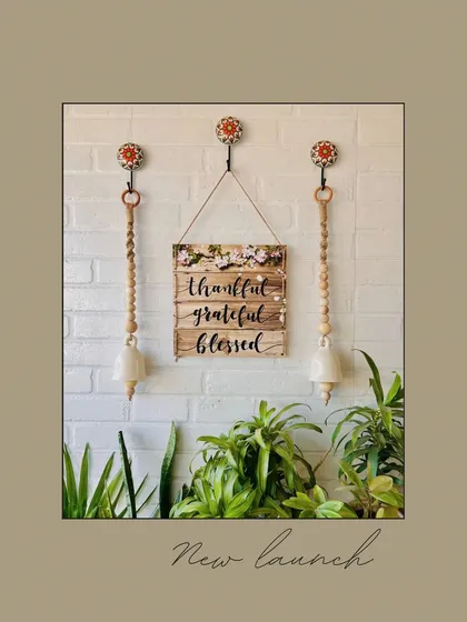 A new launch featuring our serene jute ivory bells. This wall decor set combines the bells with a 'Thankful, Grateful, Blessed' wooden hanging, all suspended from hand-painted ceramic hooks for an earthy, boho look.