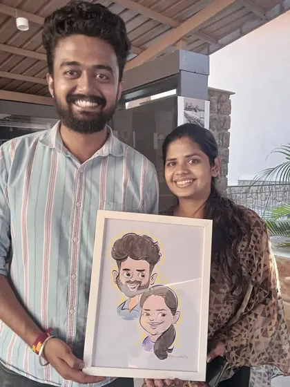 The smiles say it all. This happy couple is holding their custom-framed caricature, a perfect memento to celebrate their relationship. These make for great anniversary or wedding gifts.
