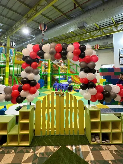 The entrance to our indoor soft play area, decorated with a balloon arch to match the race car party theme. The fun continues inside and out!