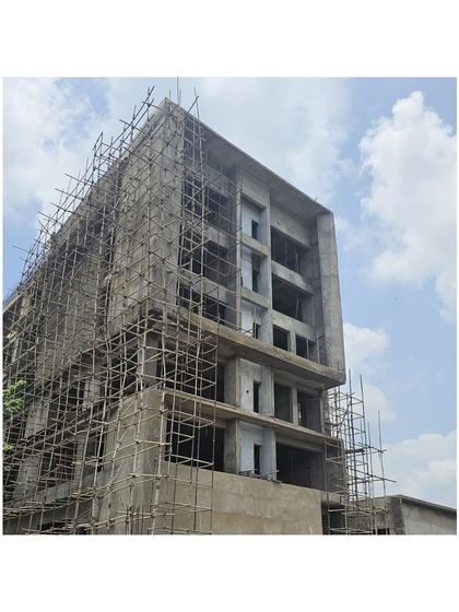 The Miner’s Training Academy under construction. This image shows the concrete shell of the building, revealing the complex geometry and structural framework before the façade is applied.