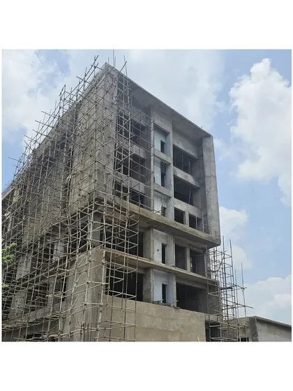 The Miner’s Training Academy under construction. This image shows the concrete shell of the building, revealing the complex geometry and structural framework before the façade is applied.