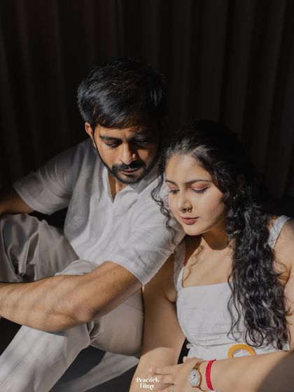 A tender moment captured in the shadows. This artistic pre-wedding portrait highlights the couple's closeness and the gentle emotion shared between them.
