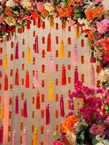 A close-up of the hanging tassels and marigold strings, a simple yet effective decorative element.