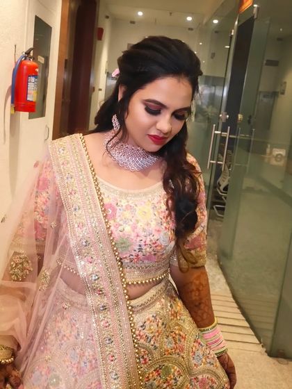 A close-up of the engagement makeup, featuring a smokey eye and a bright pink lip.