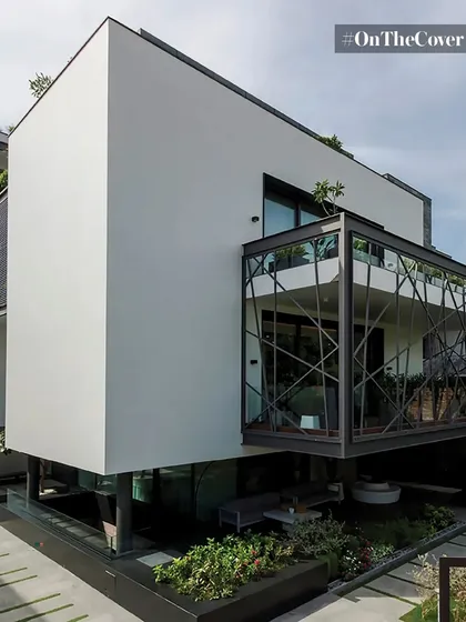 This architectural sanctuary in Gurugram features a kinetic metal sculpture that sets a tone of endless evolution. The structure itself, with its clean white volumes and a glass-enclosed bridge, shows a mastery of creating environments that are beautiful and timeless.