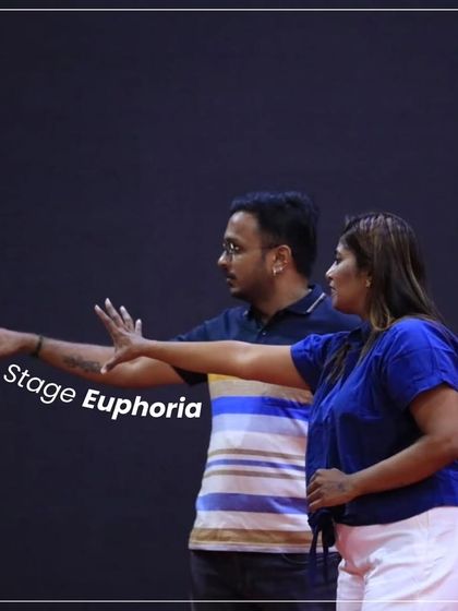 Stage euphoria is real. Here I am with my associate, blocking out movements on stage. There's a special energy you feel when you're in the performance space, and it fuels our creativity.