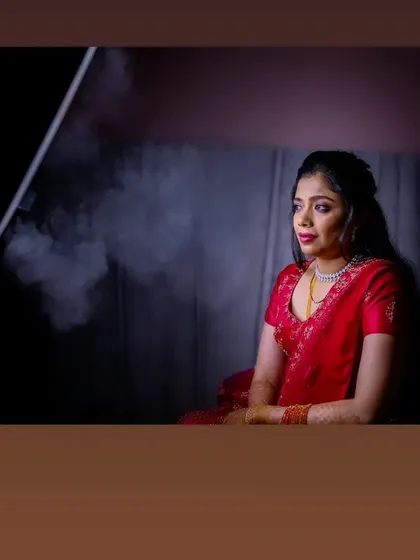 A dramatic, smoky shot of Vasudha during her reception photoshoot.