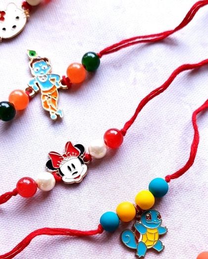 From Krishna and Minnie Mouse to Pokémon, I have a character Rakhi for every kid. These are all handmade with colorful beads on a classic red thread.