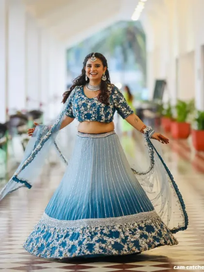 Feel the joy of celebration in this beautiful blue ombre lehenga. The floral embroidery on the blouse and the heavy work on the skirt make it a standout piece.
