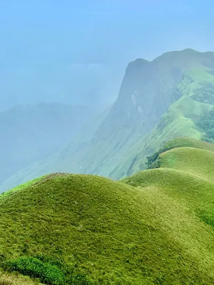 The Western Ghats are not just about waterfalls. Look at these rolling green hills on the Netravathi Peak trek. The feeling of walking above the clouds, with endless shola grasslands around you, is a different kind of magic.