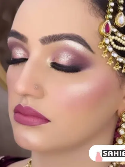 This bridal look features a stunning purple and silver shimmery eye. Paired with a matte pink lip, it creates a modern and glamorous style perfect for a reception or evening wedding.
