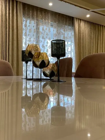 There is so much beauty in the simplicity of natural stone. This is a close-up of the Onyx dining tabletop, showing its subtle translucency and natural patterns that make each piece one-of-a-kind.