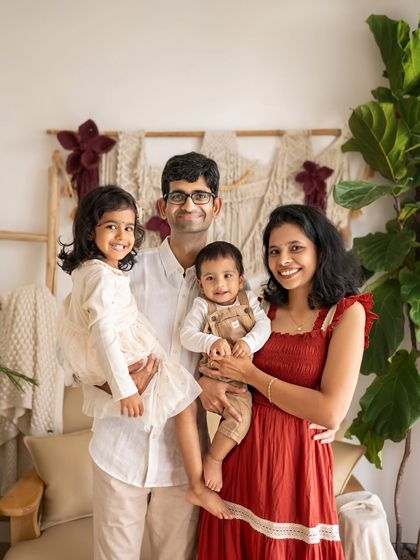 A happy family of four. Documenting this moment in time, with all its smiles and love, creates a happy memory for tomorrow.