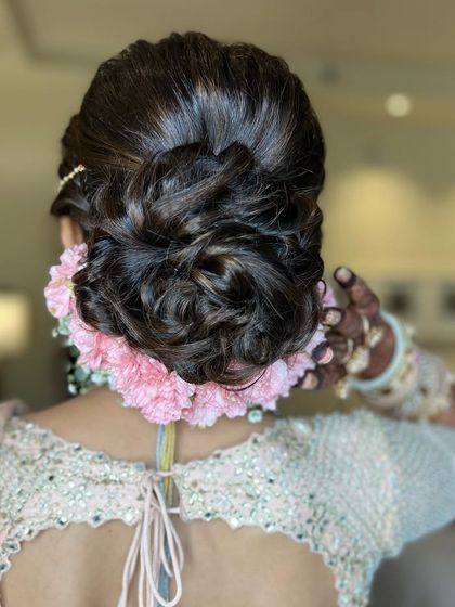 This angle highlights the beautiful shape of the updo and the delicate placement of the flowers.