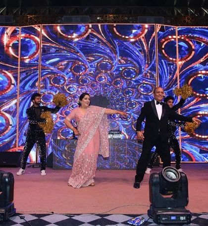 Parents performing with professional backup dancers. We can add a professional touch to make any performance look grander.