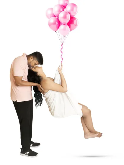 Let's have some fun with creative concepts. This composite image creates a whimsical scene of being lifted by balloons, showing that maternity photos can be both elegant and playful.