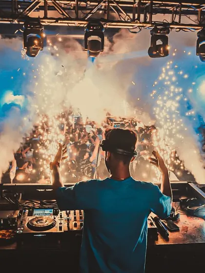 My view from the DJ booth at Waters, Pune, as cold pyro sparks light up the crowd. I use a variety of effects to create a dynamic and visually stunning show.