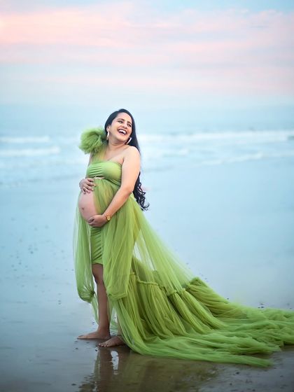 Pure joy by the ocean. The laughter in this shot is infectious, captured as the waves gently lap the shore.