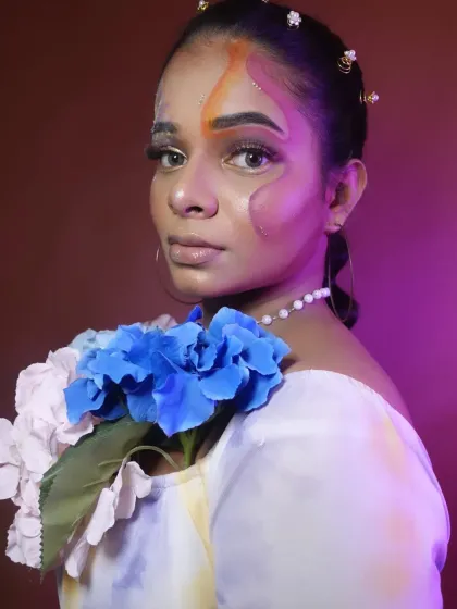 An abstract, fantasy makeup look created during a student portfolio day. We used flowers and colourful paints.