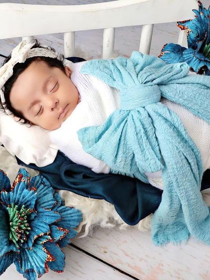 A full view of the setup, showing the contrast between the white diwan and the vibrant blue props.