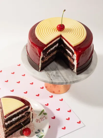 It's all about that perfect slice. This cake features a glossy mirror glaze and rich, decadent layers inside. I believe a cake must taste even better than it looks, and this one definitely delivers.
