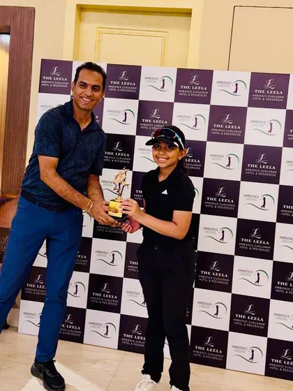 Aahana Shrivastava receives her 1st place trophy at The Leela Golf Greens Junior Golf Cup.