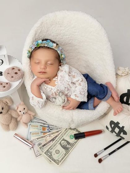 The boss lady is in. This feminine take on the theme includes a lace top, cute jeans, and props like lipstick and cookies, showing that girls can be bosses too.