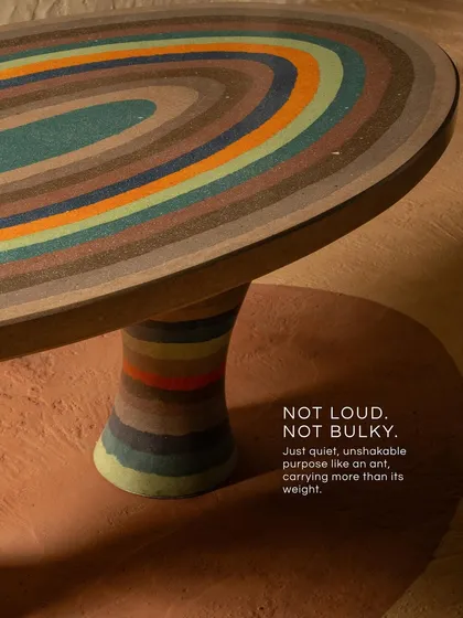 We believe furniture should be functional art. Inspired by the quiet strength of an ant, this terrazzo table combines a sculptural form with a richly textured, multi-colored surface, creating a piece that grounds the room with its unique presence.