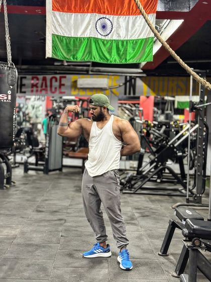 16-inch arms. A front bicep flex under the Indian flag. A milestone achieved through hard work and dedication.