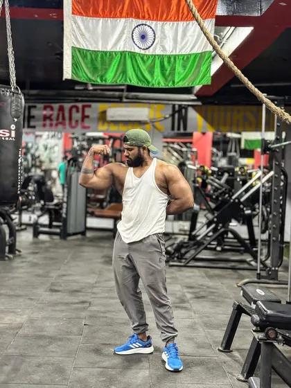 16-inch arms. A front bicep flex under the Indian flag. A milestone achieved through hard work and dedication.