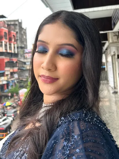 A photo of a beautiful blue smokey eye look, taught to students to handle bold and dramatic styles.