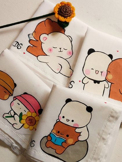 A full set of my Bubu and Dudu inspired handkerchiefs. Each one shows the cute bears in a different scene, from reading together to holding sunflowers.